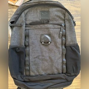 Gray and black Oakley backpack